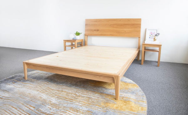 A flat solid wood bed base can help to make a mattress more firm